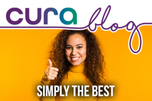 An image of a young woman wearing an orange top with her thumbs up, the words Simply the Best are in front of her