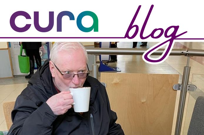 Richard Lemmon having a drink in a cafe, living with Parkinsons